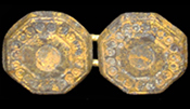 Octagonal copper alloy sleeve buttons with decoration in a circle within circles pattern.&nbsp;One shank has worn through - click on image for larger view.